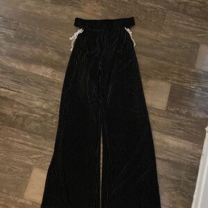 Flowy long pants with cutouts and chains
